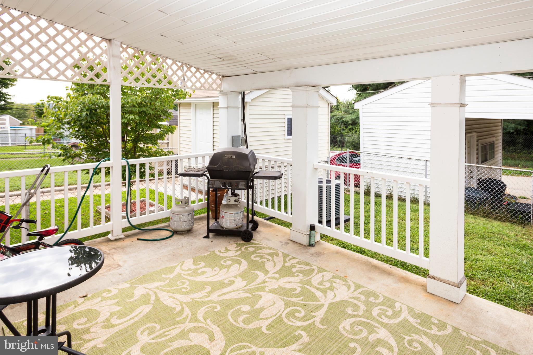 2703 Yarnall Road Halethorpe, MD 21227 - Photo 22 of 28 a view of balcony with two chairs and a yard