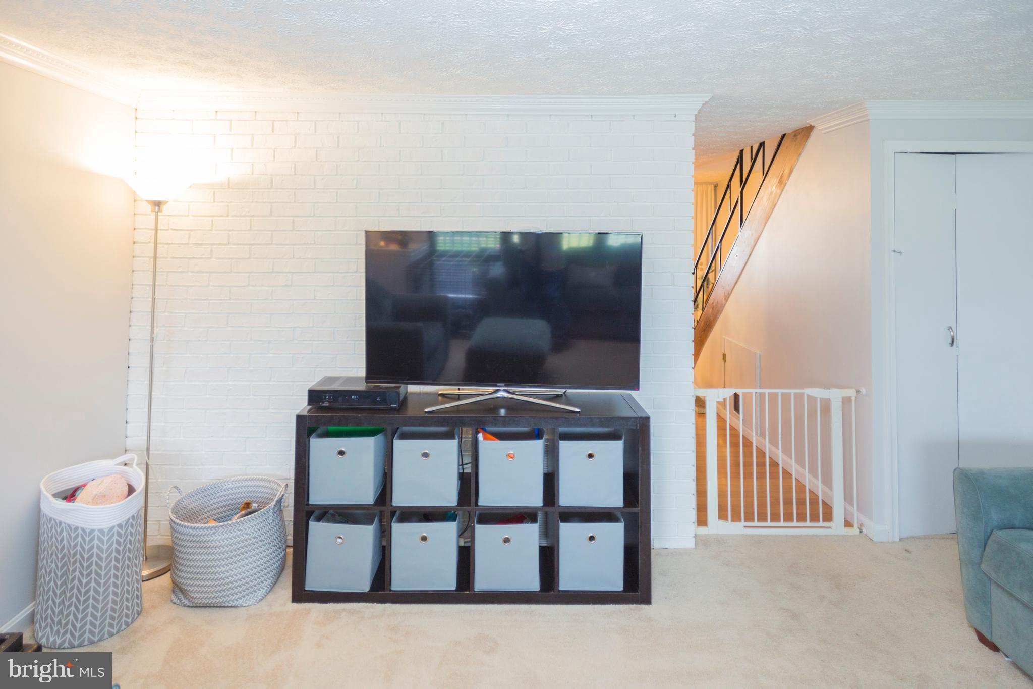 2703 Yarnall Road Halethorpe, MD 21227 - Photo 24 of 28 a living room with furniture and a flat screen tv