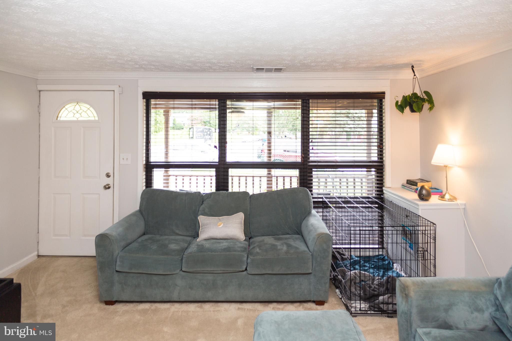 2703 Yarnall Road Halethorpe, MD 21227 - Photo 25 of 28 a living room with furniture and a window