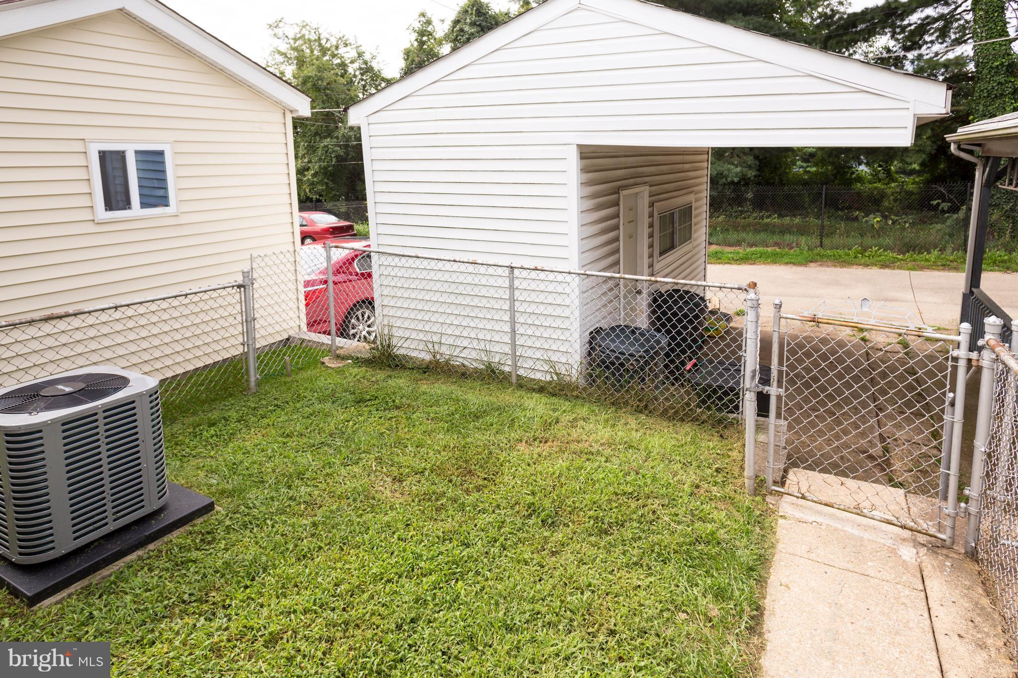 2703 Yarnall Road Halethorpe, MD 21227 - Photo 26 of 28 a view of a small house with backyard