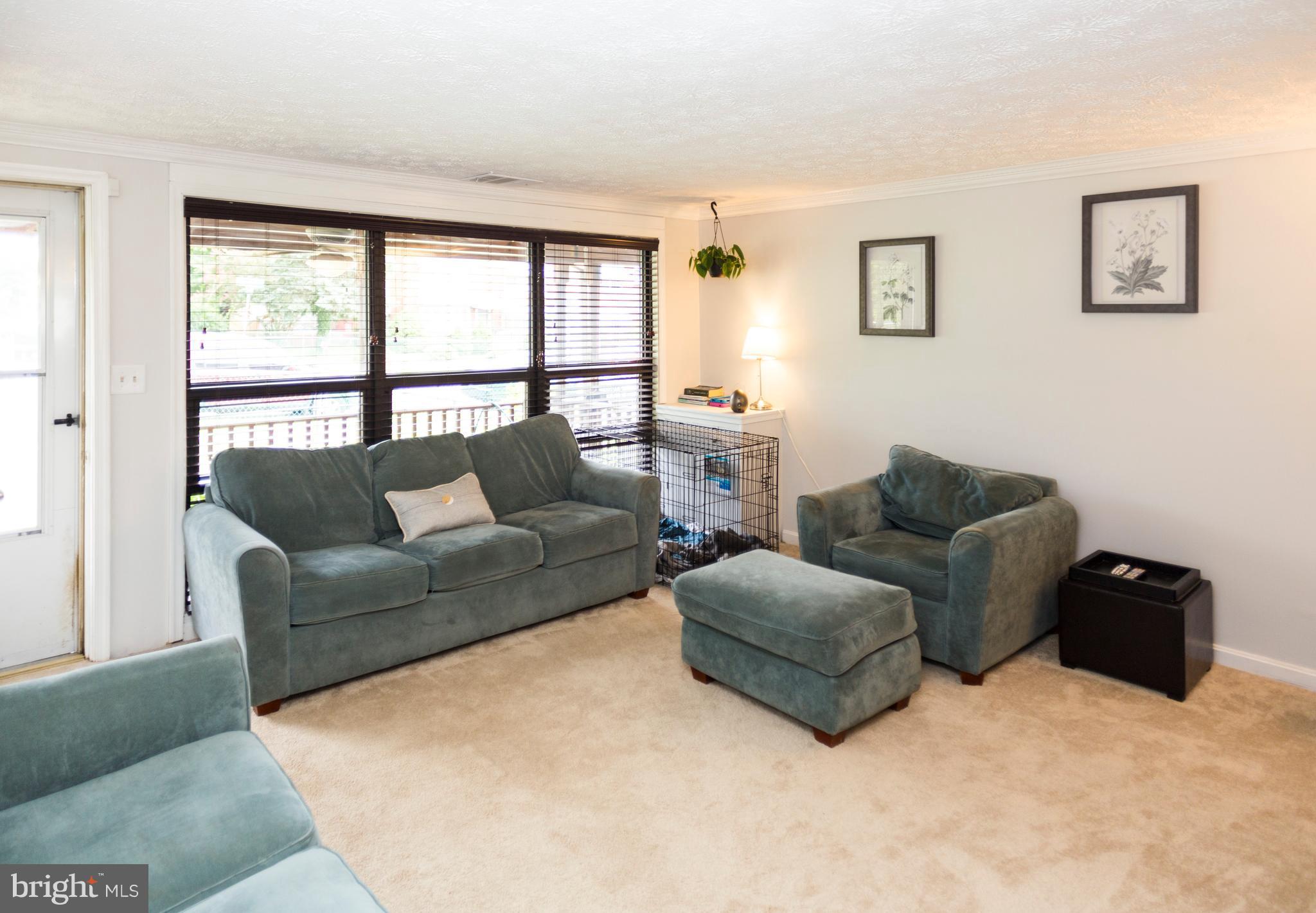 2703 Yarnall Road Halethorpe, MD 21227 - Photo 5 of 28 a living room with furniture and a window