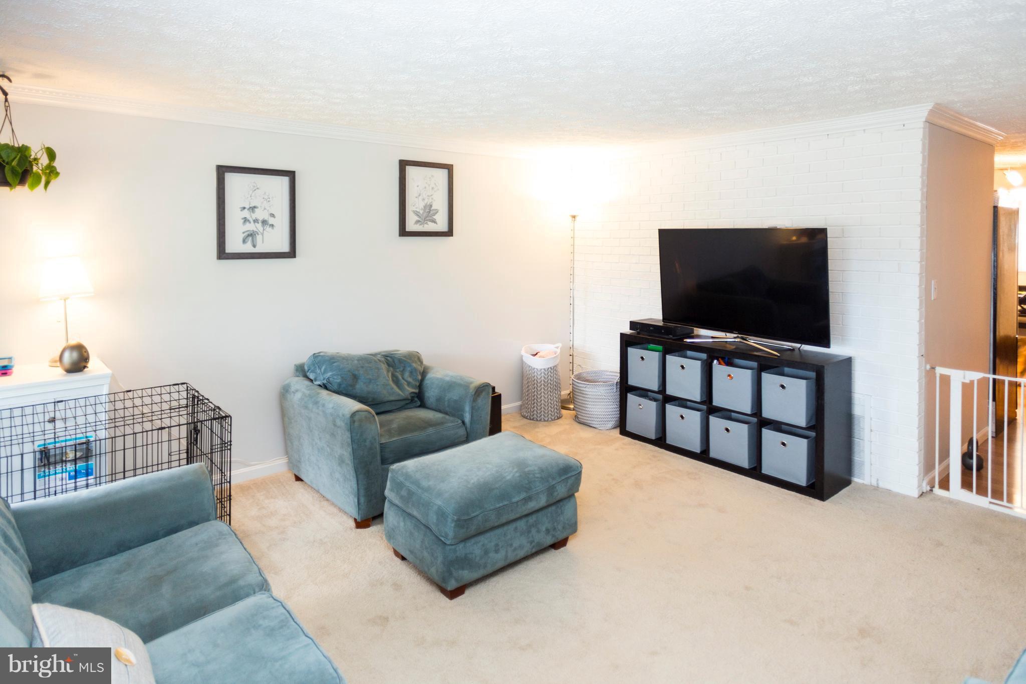 2703 Yarnall Road Halethorpe, MD 21227 - Photo 6 of 28 a living room with furniture and a flat screen tv