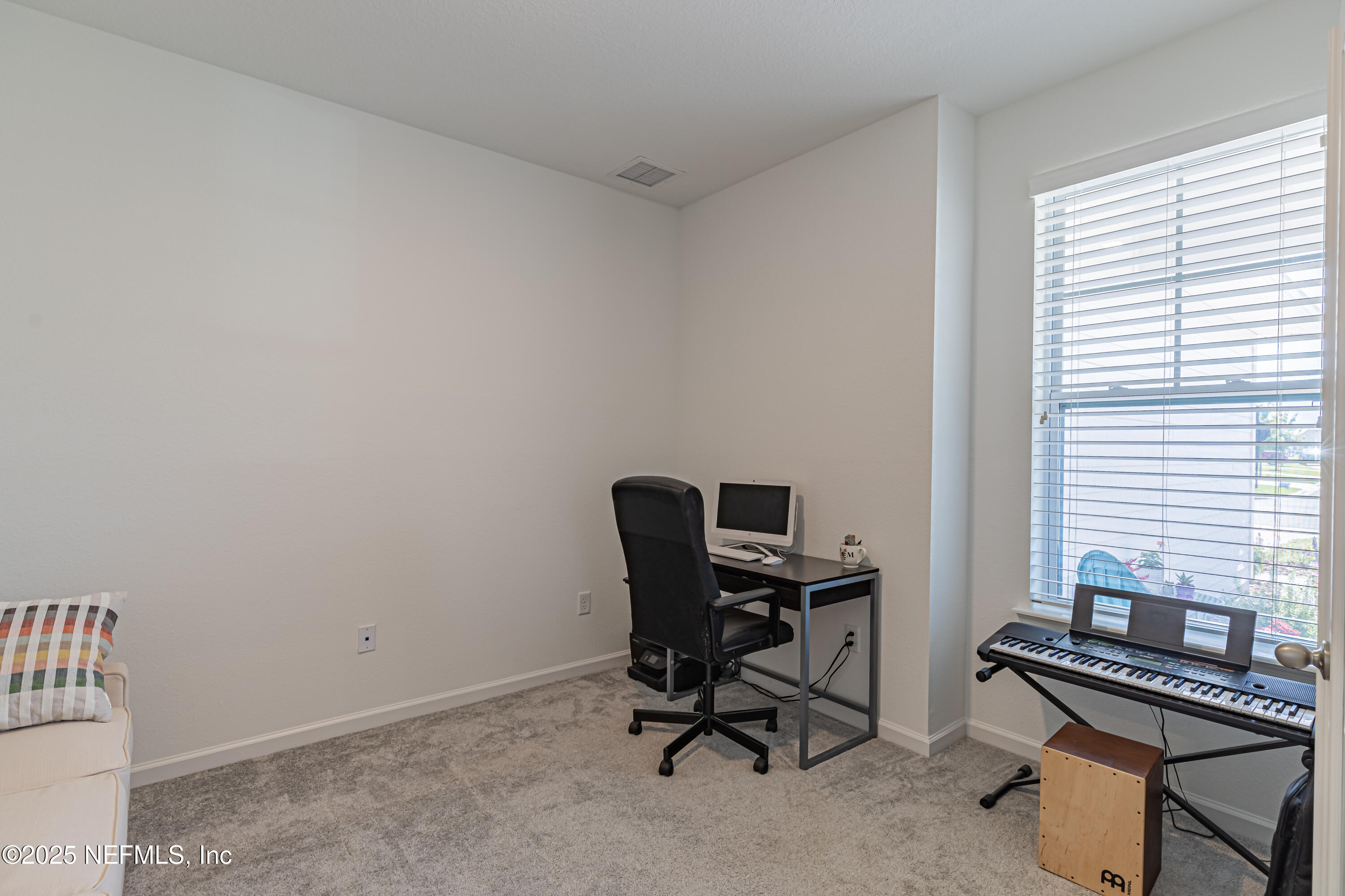 383 Windswept Way Street St. Augustine, FL 32092 - Photo 6 of 34 a view of a workspace with furniture and a window