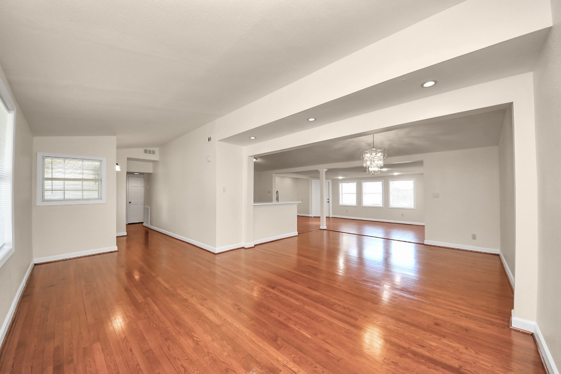 6701 Neff Street Houston, TX 77074 - Photo 8 of 44 Spacious living area with hardwood floors, recessed lighting, and open-concept layout.