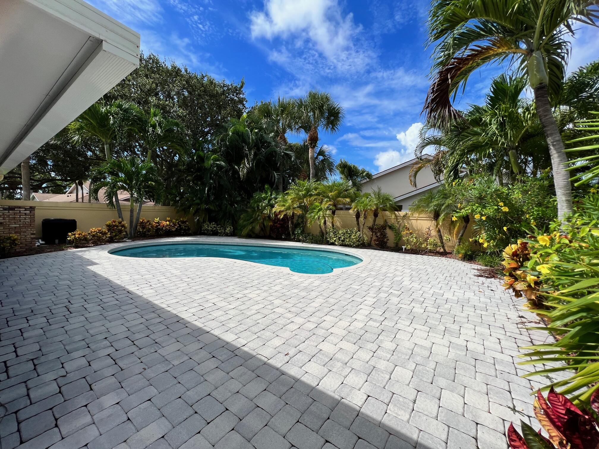 100 Cape Pointe Circle Jupiter, FL 33477 - Photo 18 of 25 a view of outdoor space with garden