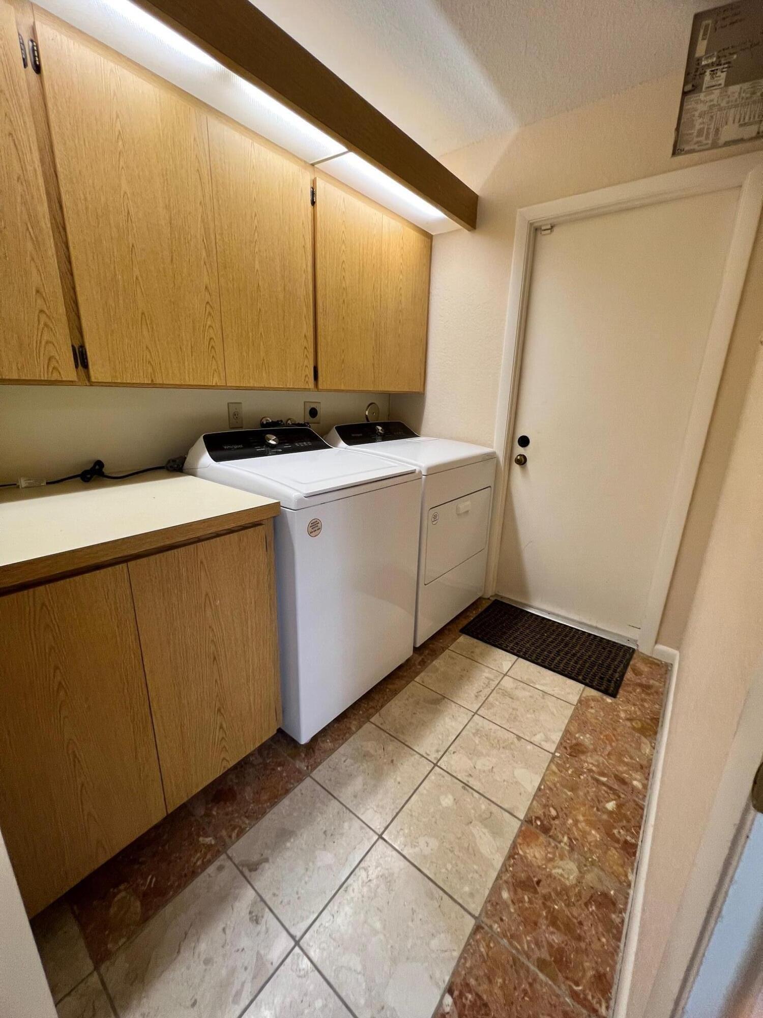 100 Cape Pointe Circle Jupiter, FL 33477 - Photo 22 of 33 a view of a kitchen with cabinets