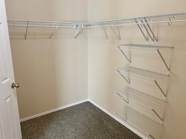 a view of a room with racks on the wall