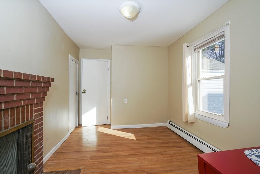 1309 Washington Street Canton, MA 02021 - Photo 16 of 35 a view of an empty room with wooden floor and a window