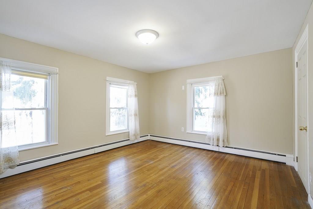 1309 Washington Street Canton, MA 02021 - Photo 22 of 35 an empty room with wooden floor and windows