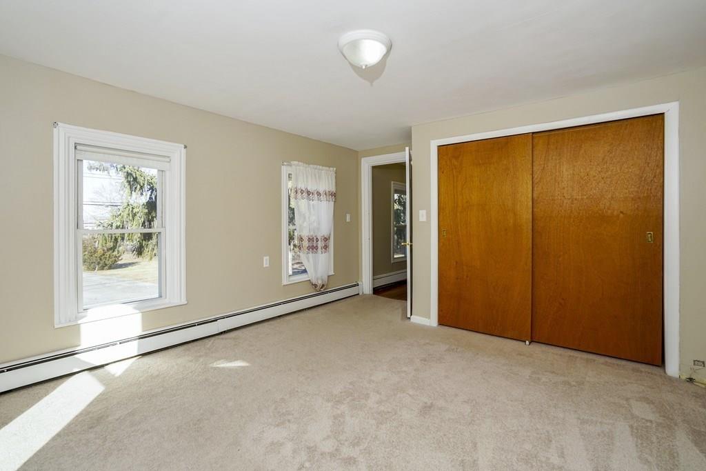 1309 Washington Street Canton, MA 02021 - Photo 25 of 35 an empty room with windows and closet