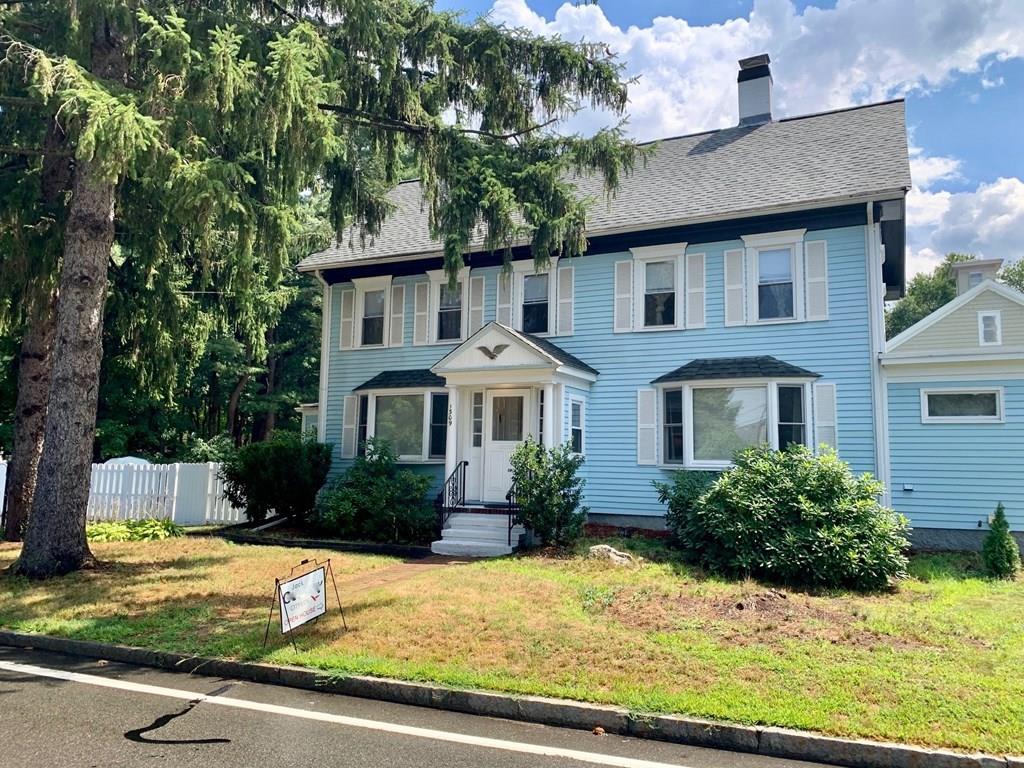 1309 Washington Street Canton, MA 02021 - Photo 32 of 35 a front view of a house with yard and garage
