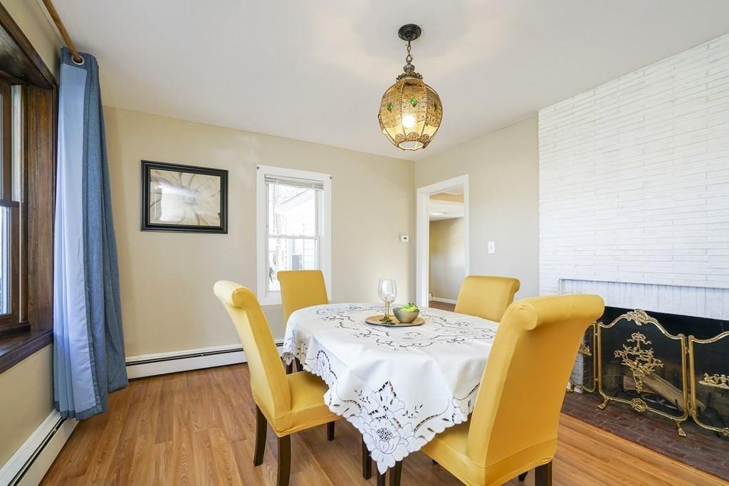 1309 Washington Street Canton, MA 02021 - Photo 10 of 35 a view of a dining room with furniture and wooden floor