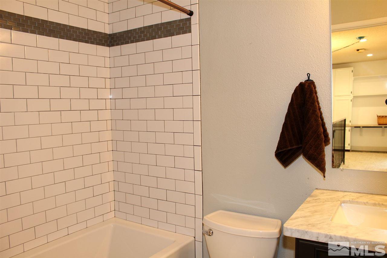 3824 Bexley Square Reno, NV 89503 - Photo 17 of 25 a bathroom with a bathtub and a toilet