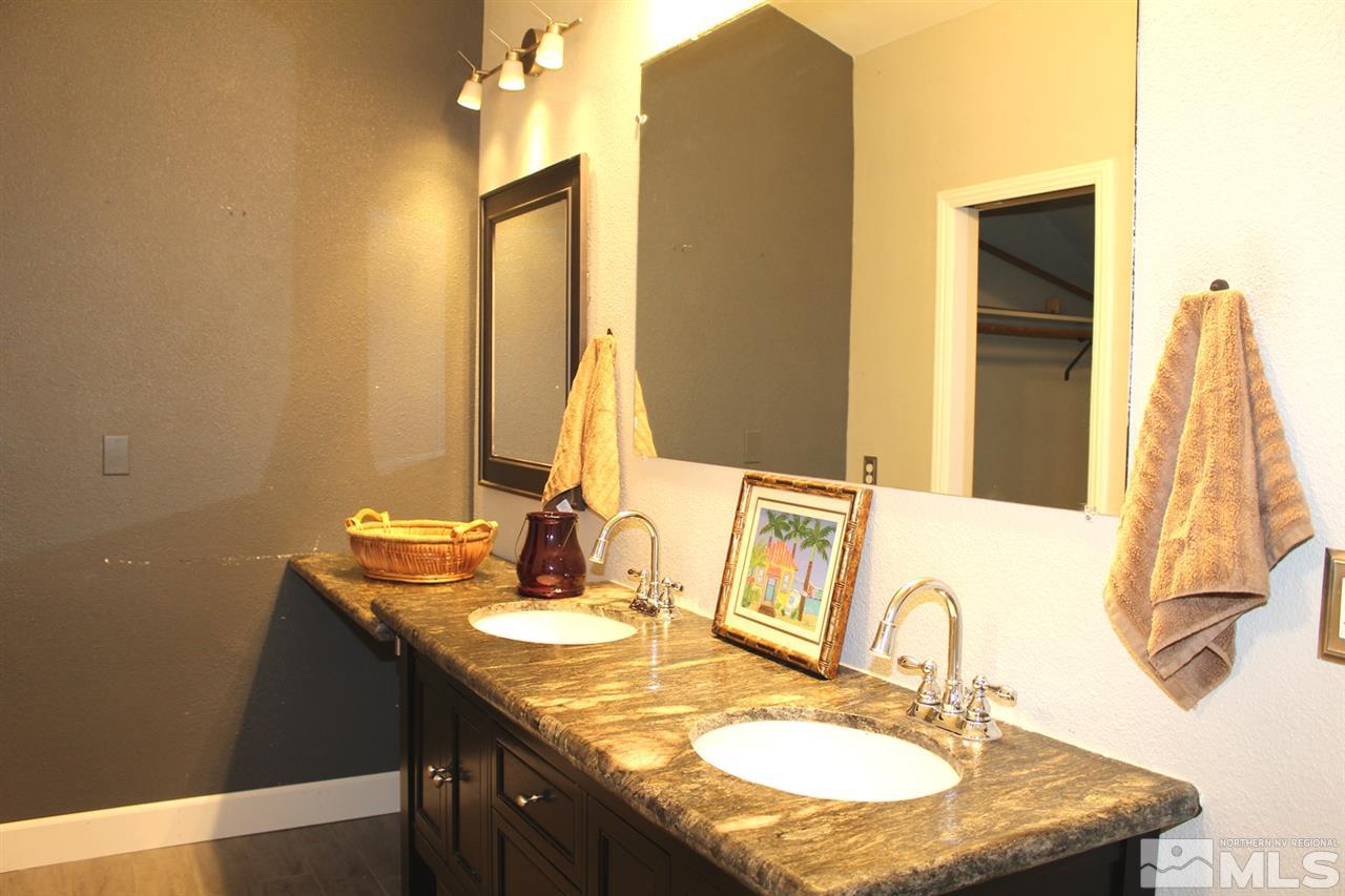 3824 Bexley Square Reno, NV 89503 - Photo 22 of 25 a bathroom with a granite countertop sink and a mirror