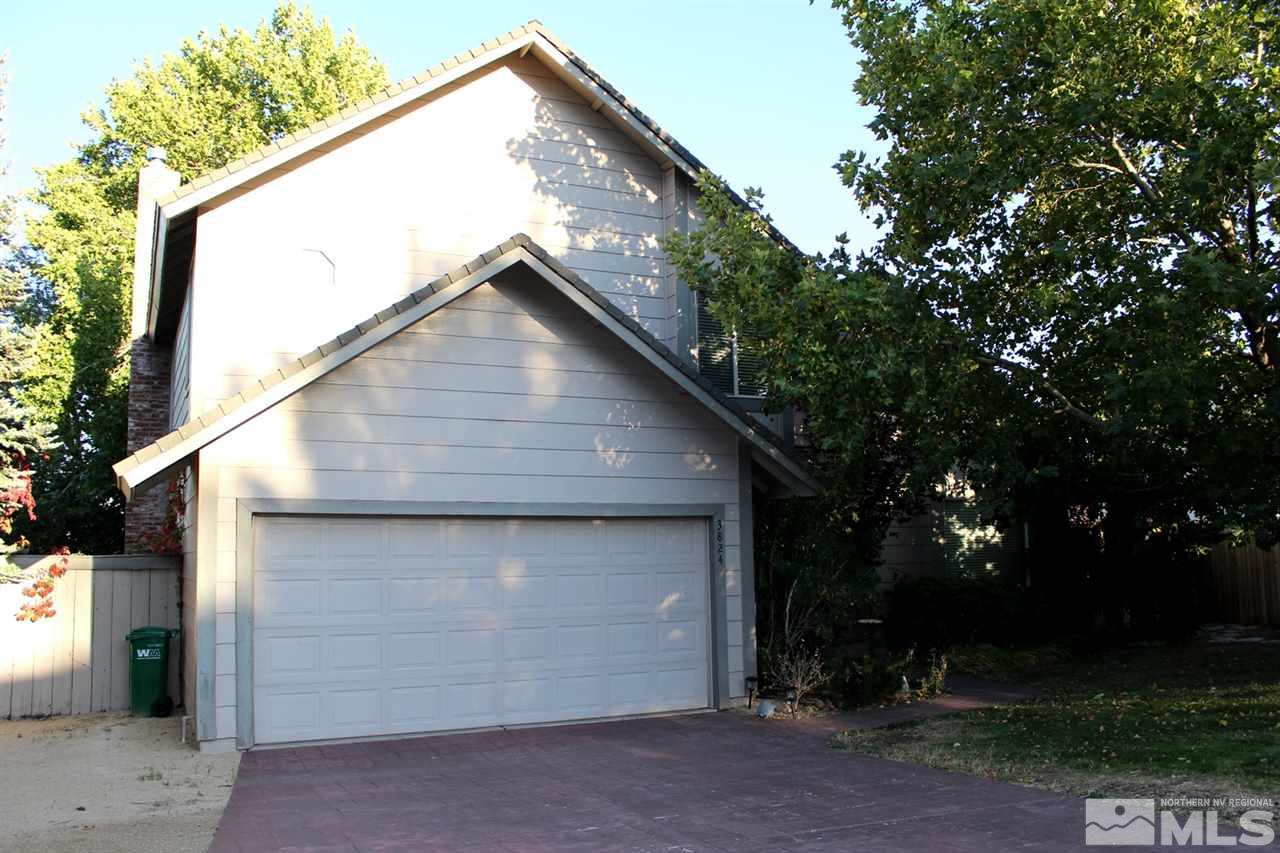 3824 Bexley Square Reno, NV 89503 - Photo 3 of 25 a front view of a house with a yard and garage