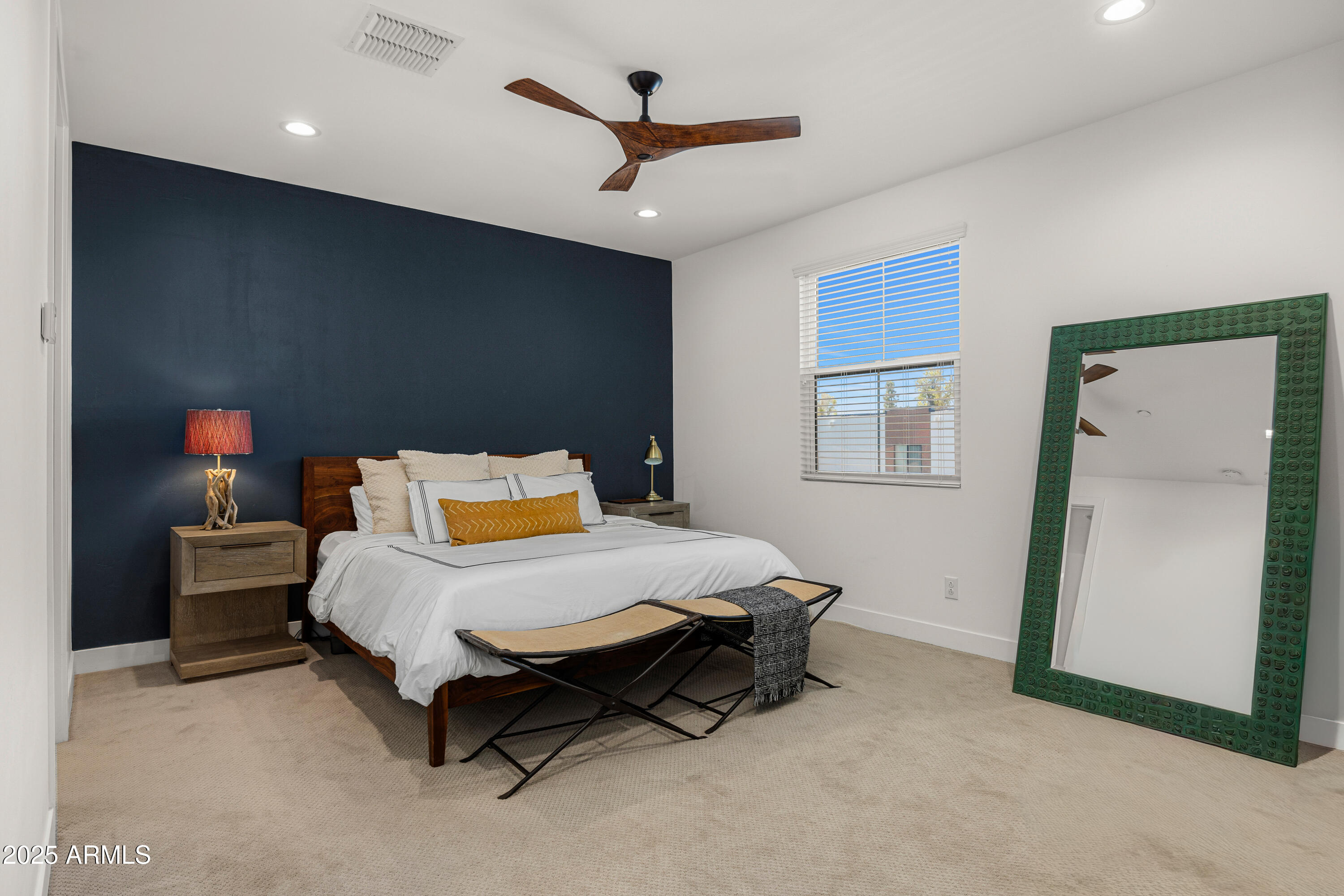 3200 North 39th Street, Unit 11 Phoenix, AZ 85018 - Photo 11 of 24 a bedroom with a bed and a ceiling fan