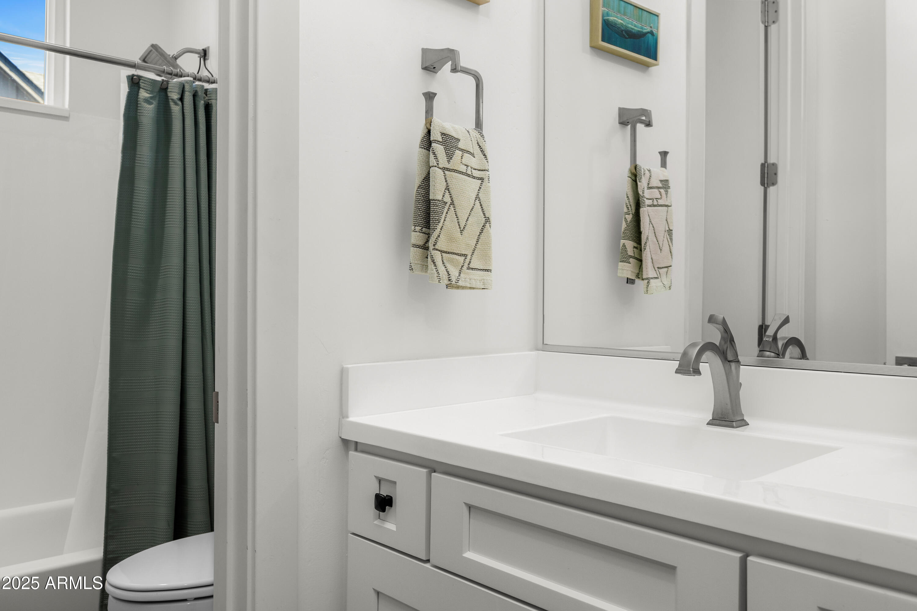 3200 North 39th Street, Unit 11 Phoenix, AZ 85018 - Photo 19 of 24 a bathroom with a sink and a mirror