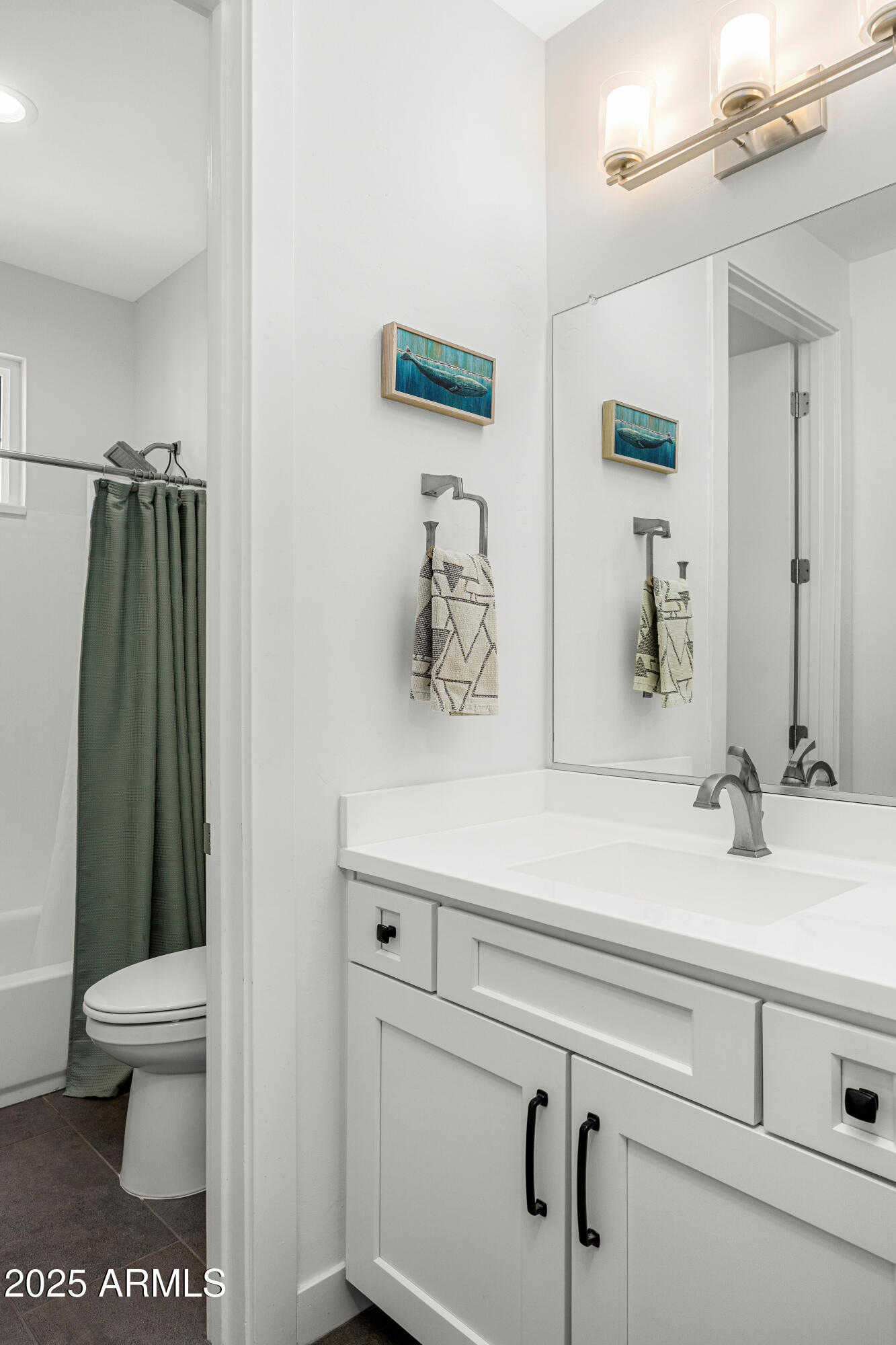 3200 North 39th Street, Unit 11 Phoenix, AZ 85018 - Photo 20 of 24 a bathroom with a sink and a mirror