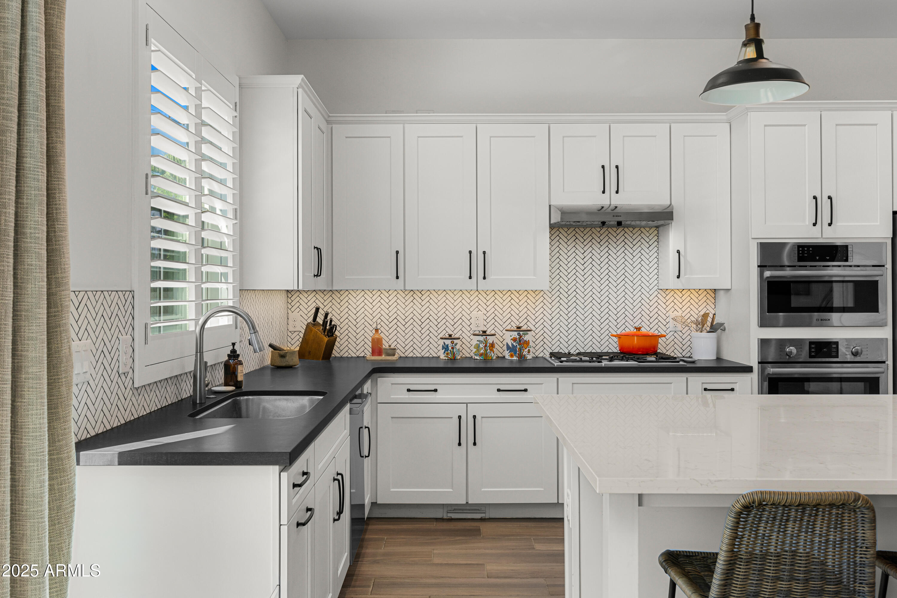 3200 North 39th Street, Unit 11 Phoenix, AZ 85018 - Photo 7 of 24 a kitchen with stainless steel appliances granite countertop a sink a stove and cabinets