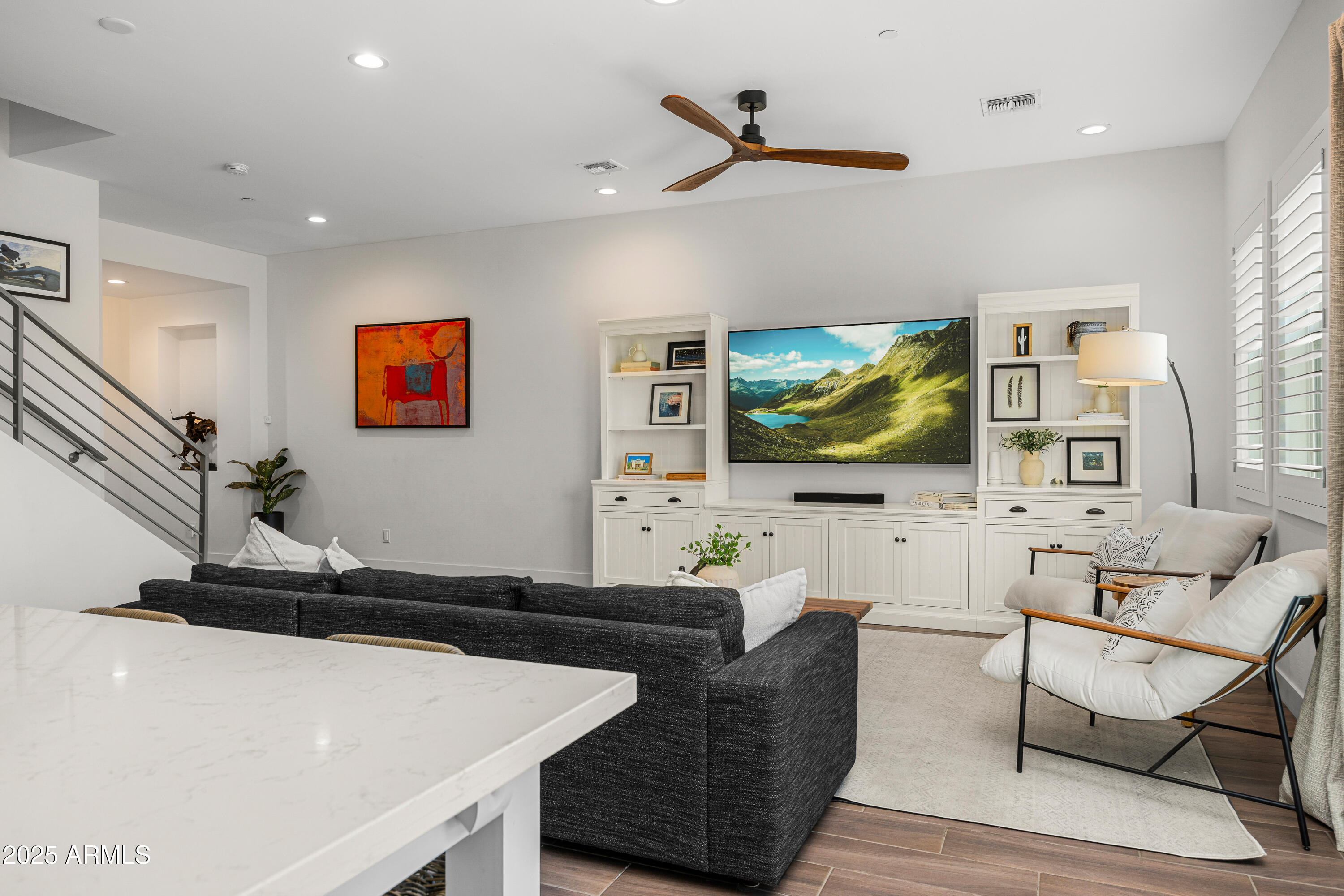 3200 North 39th Street, Unit 11 Phoenix, AZ 85018 - Photo 8 of 24 a living room with furniture and a flat screen tv