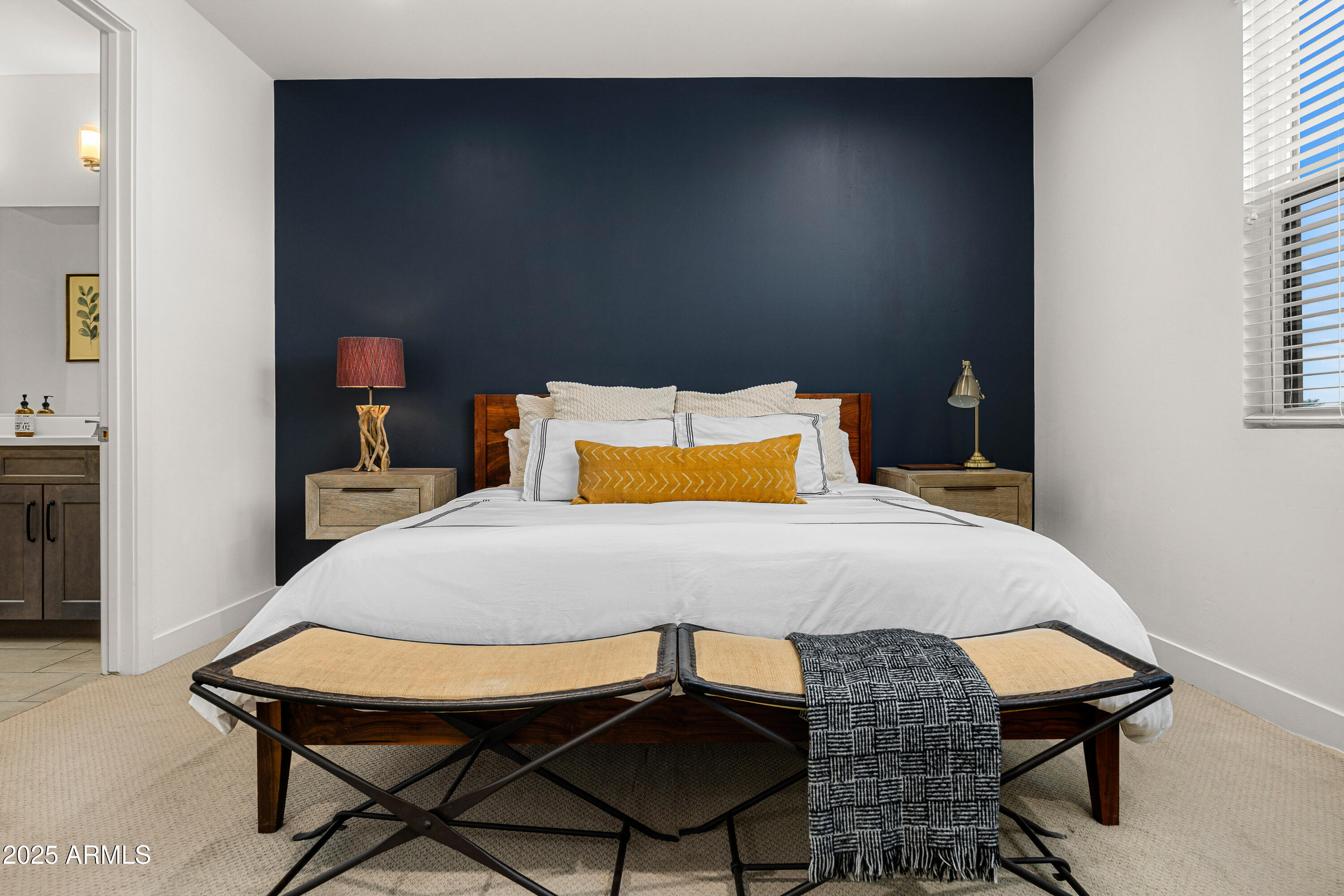 3200 North 39th Street, Unit 11 Phoenix, AZ 85018 - Photo 10 of 24 a bedroom with a bed a table and chair