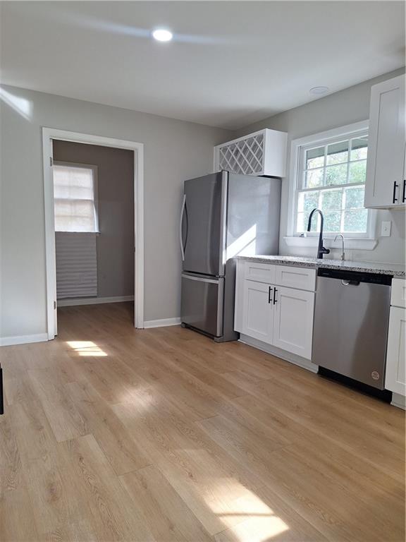 1605 Brockett Road Tucker, GA 30084 - Photo 12 of 12 a view of a kitchen with granite countertop a stove top oven and sink