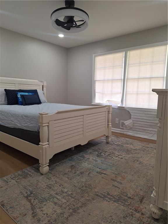 1605 Brockett Road Tucker, GA 30084 - Photo 2 of 12 a spacious bedroom with a bed and a large window
