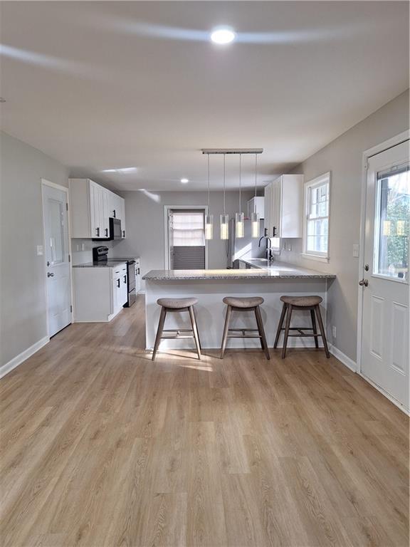 1605 Brockett Road Tucker, GA 30084 - Photo 6 of 12 a view of a kitchen with dining table and chairs
