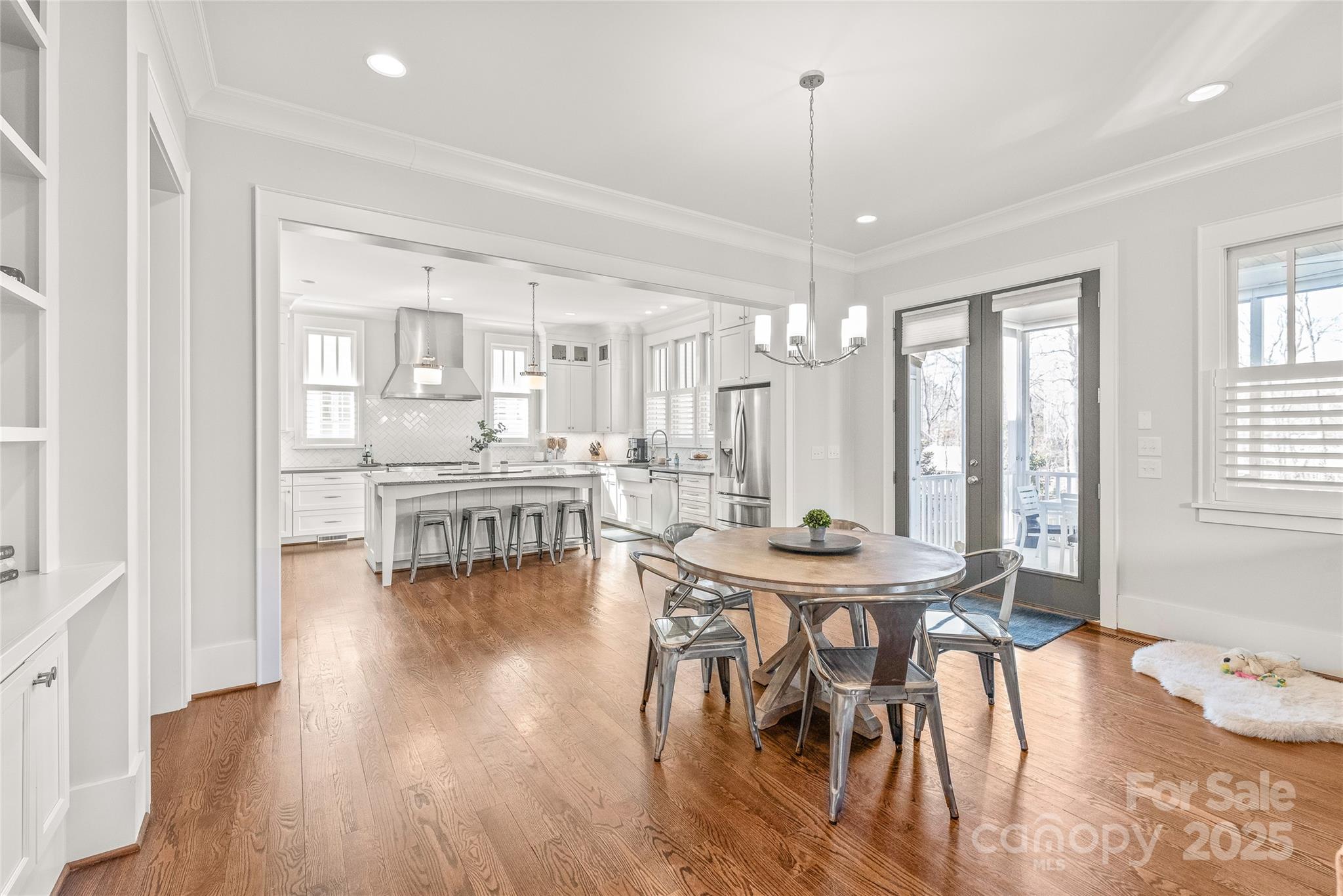 5717 Closeburn Road Charlotte, NC 28210 - Photo 12 of 40 a dining room with furniture and wooden floor