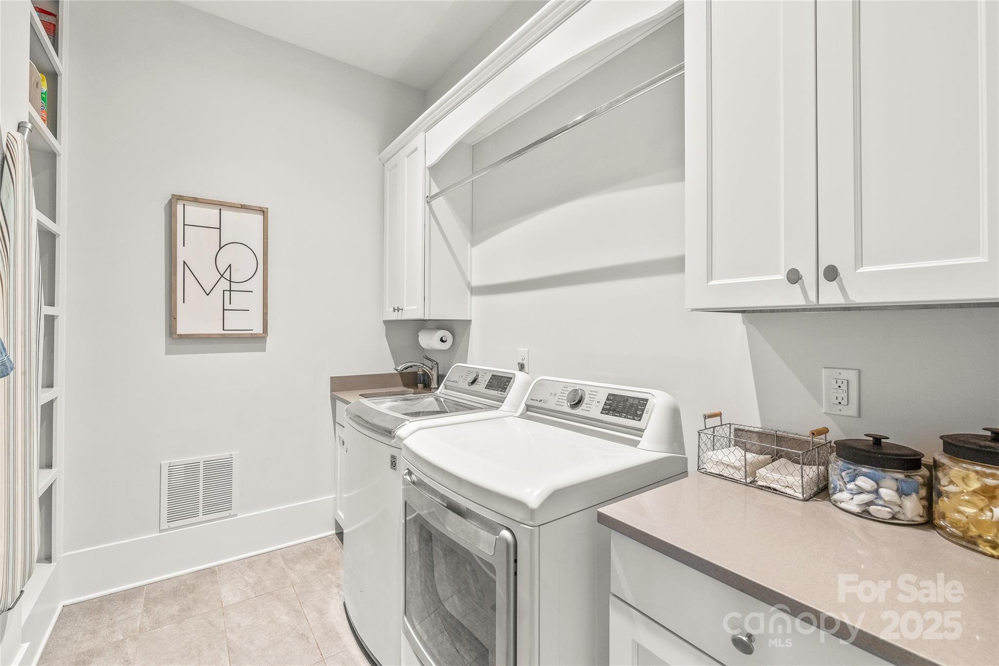 5717 Closeburn Road Charlotte, NC 28210 - Photo 15 of 40 a utility room with a sink dryer and washer