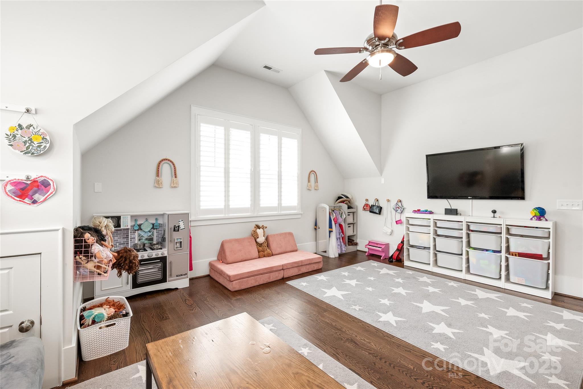 5717 Closeburn Road Charlotte, NC 28210 - Photo 19 of 40 a living room with furniture and a flat screen tv