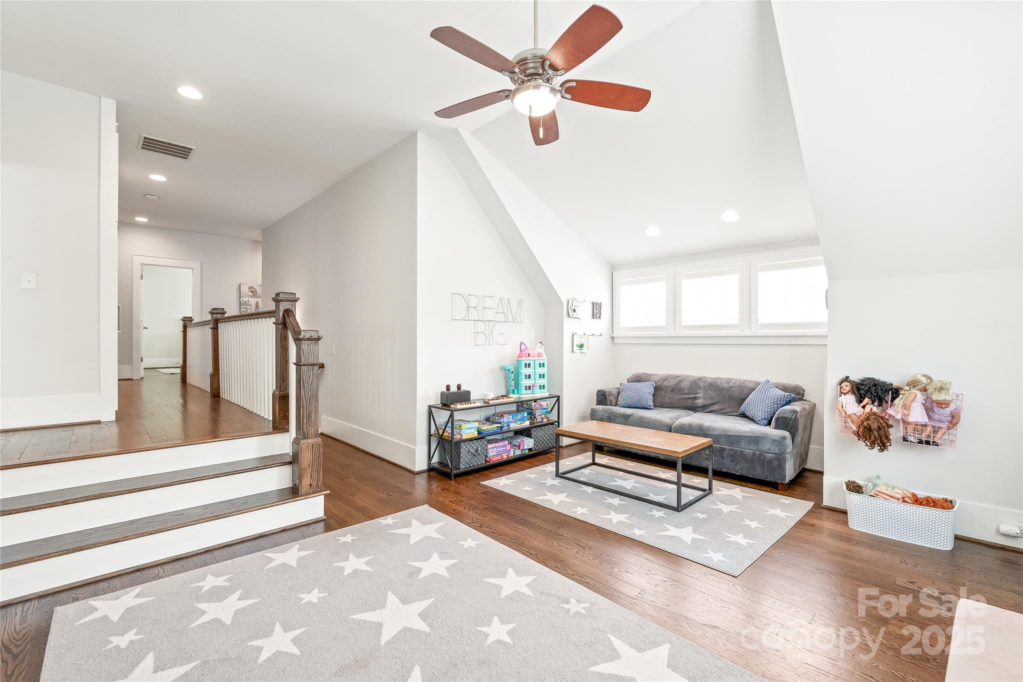 5717 Closeburn Road Charlotte, NC 28210 - Photo 20 of 40 a living room with furniture and a chandelier