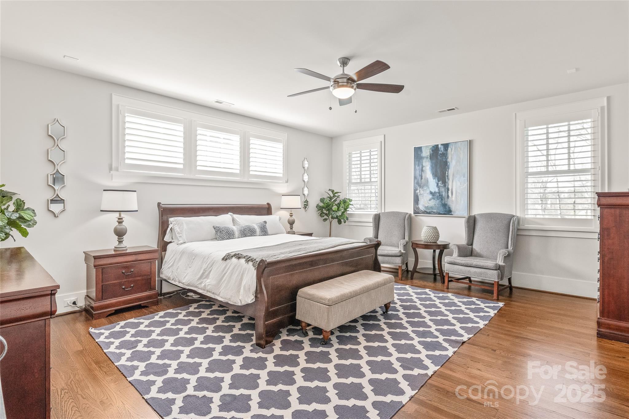 5717 Closeburn Road Charlotte, NC 28210 - Photo 21 of 40 a spacious bedroom with a bed and wooden floor