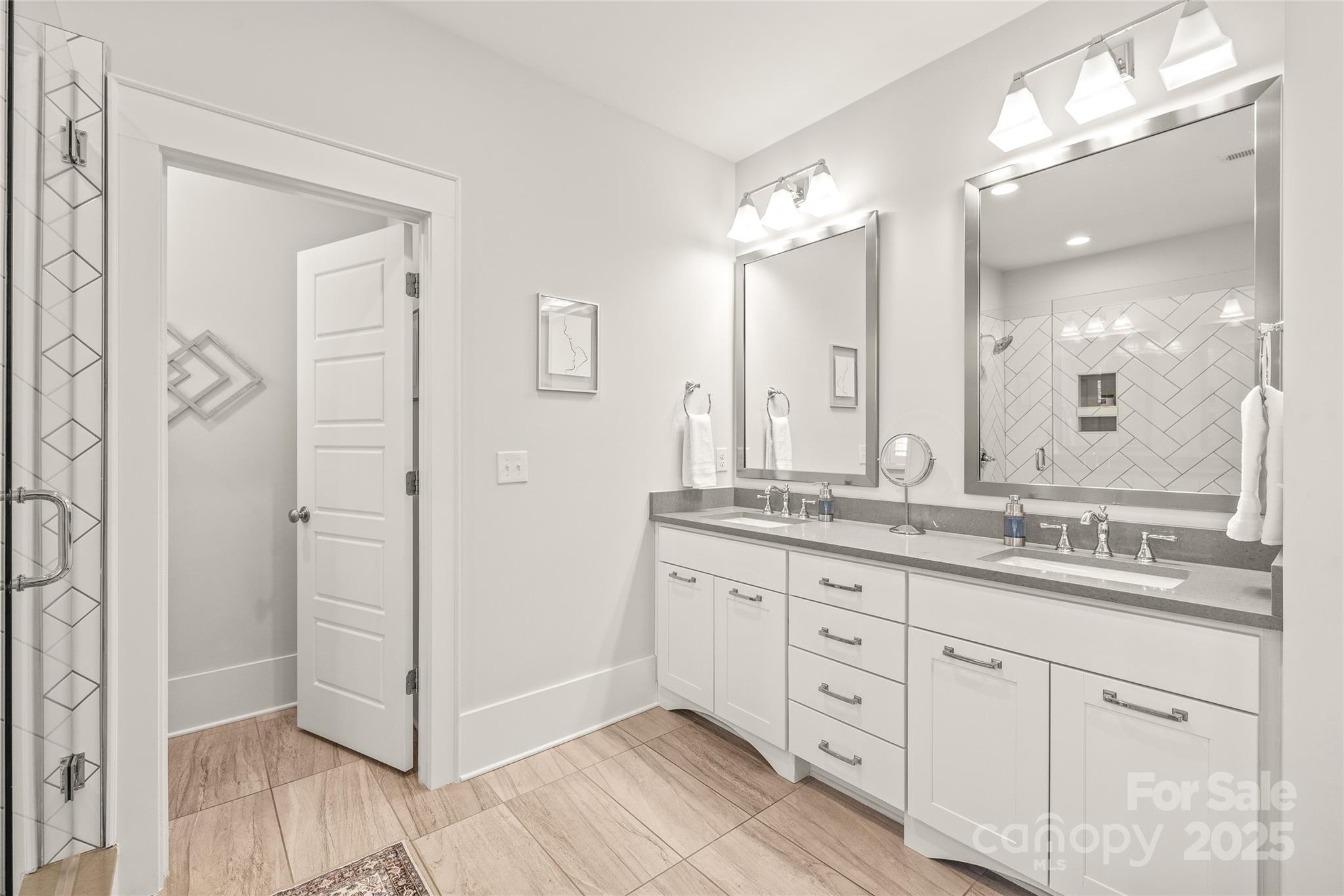 5717 Closeburn Road Charlotte, NC 28210 - Photo 23 of 40 a bathroom with a granite countertop sink mirror and a shower