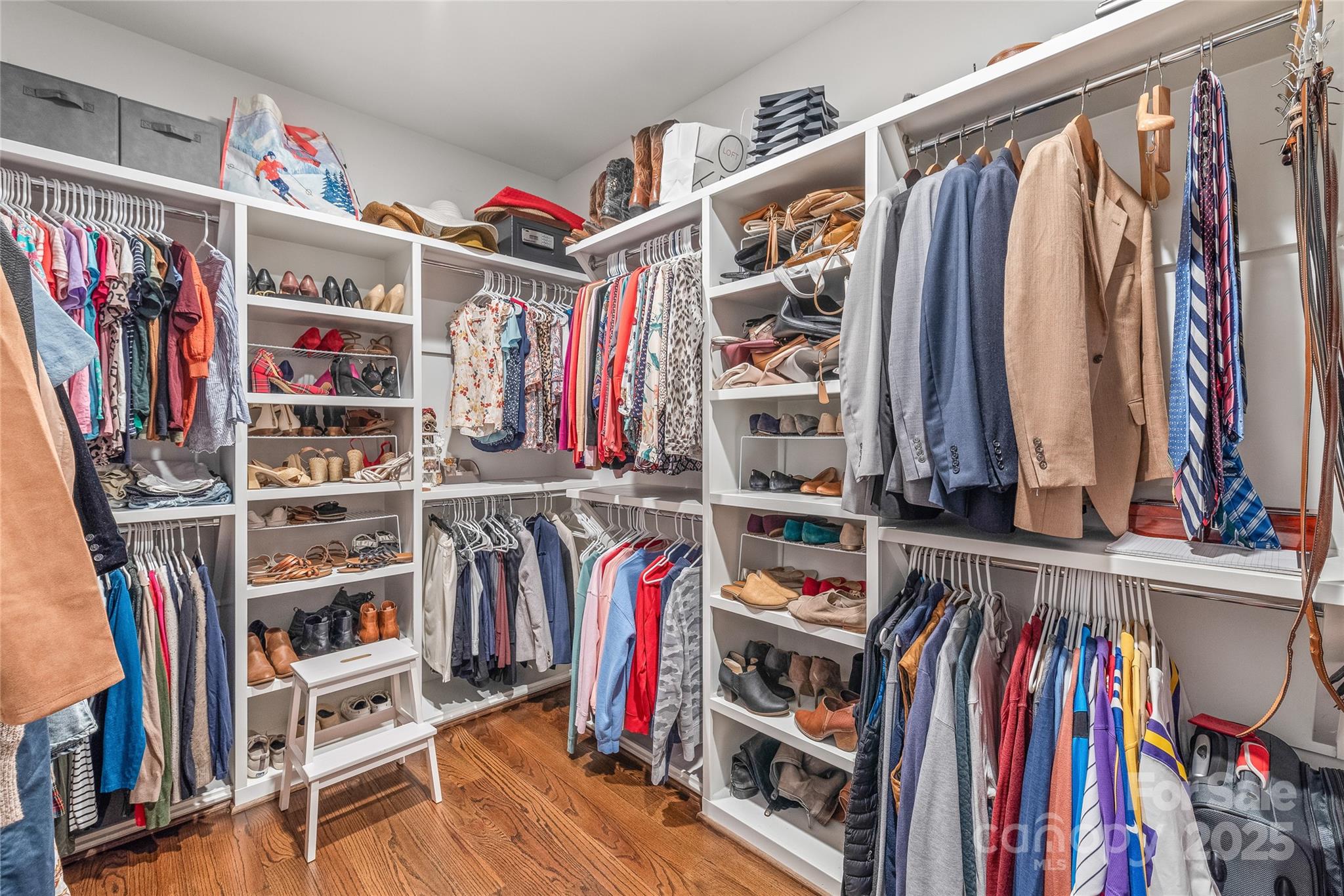 5717 Closeburn Road Charlotte, NC 28210 - Photo 25 of 40 a view of walk in closet with clothes and shoes