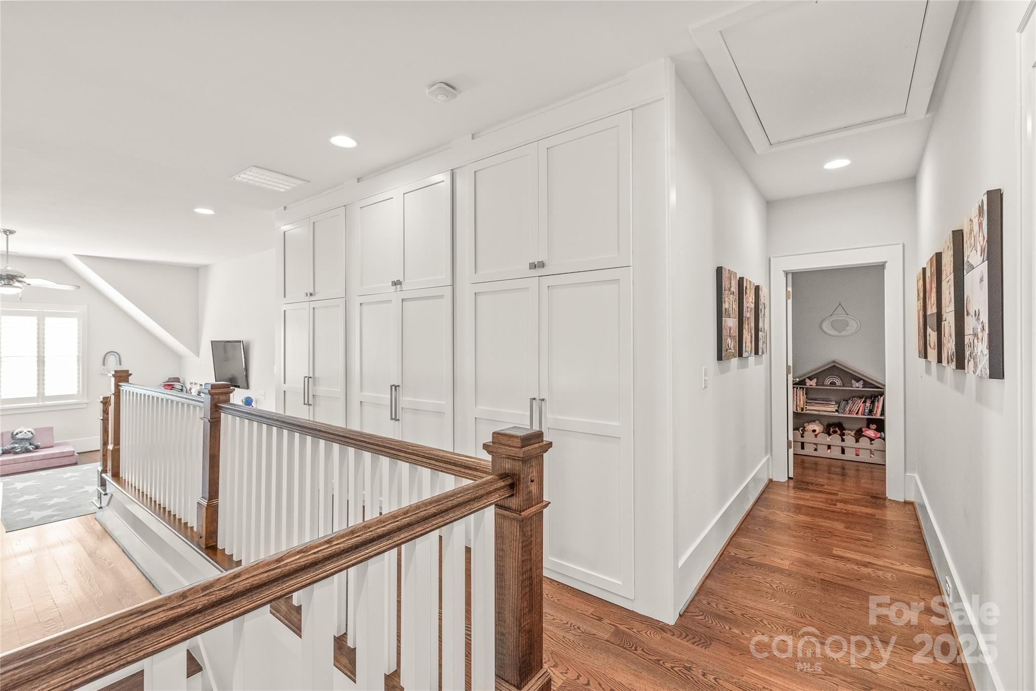 5717 Closeburn Road Charlotte, NC 28210 - Photo 26 of 40 a view of a hallway with wooden floor and staircase