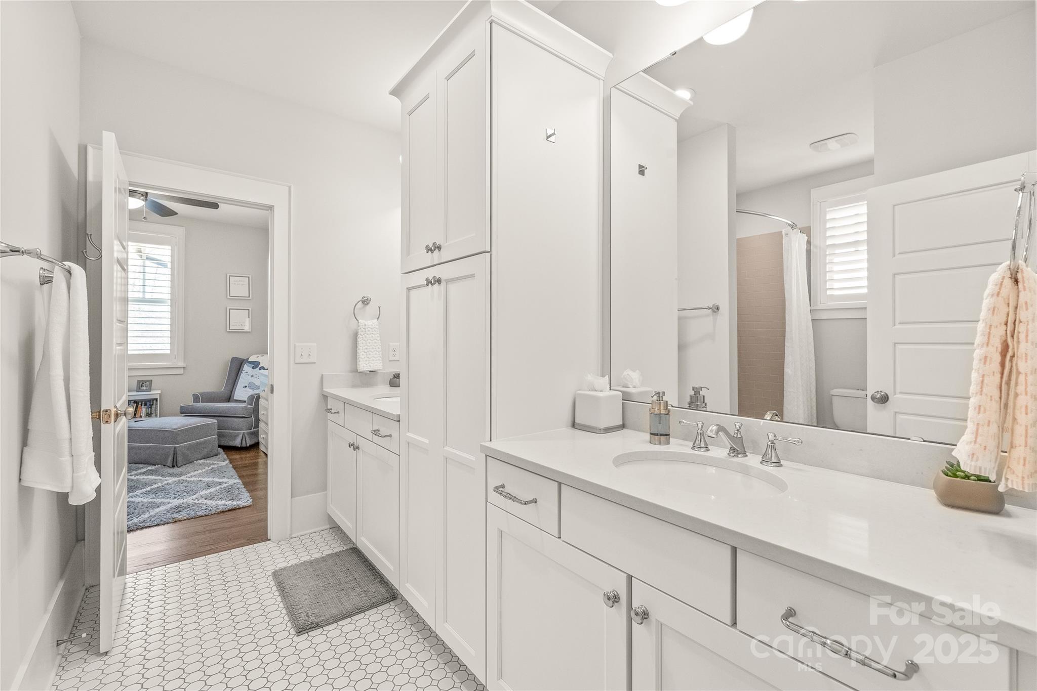 5717 Closeburn Road Charlotte, NC 28210 - Photo 28 of 40 a spacious bathroom with double vanity and mirrors