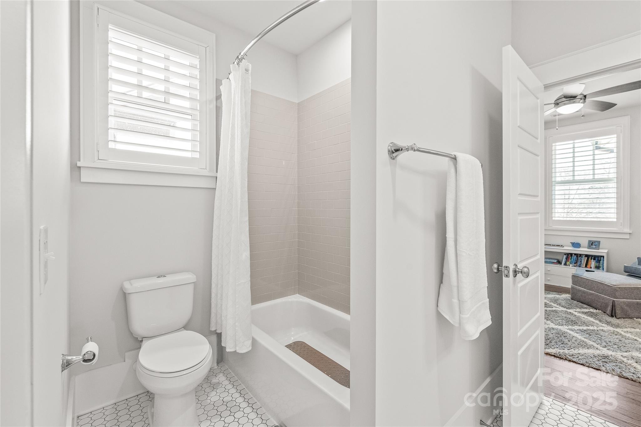 5717 Closeburn Road Charlotte, NC 28210 - Photo 29 of 40 a bathroom with a toilet and a shower