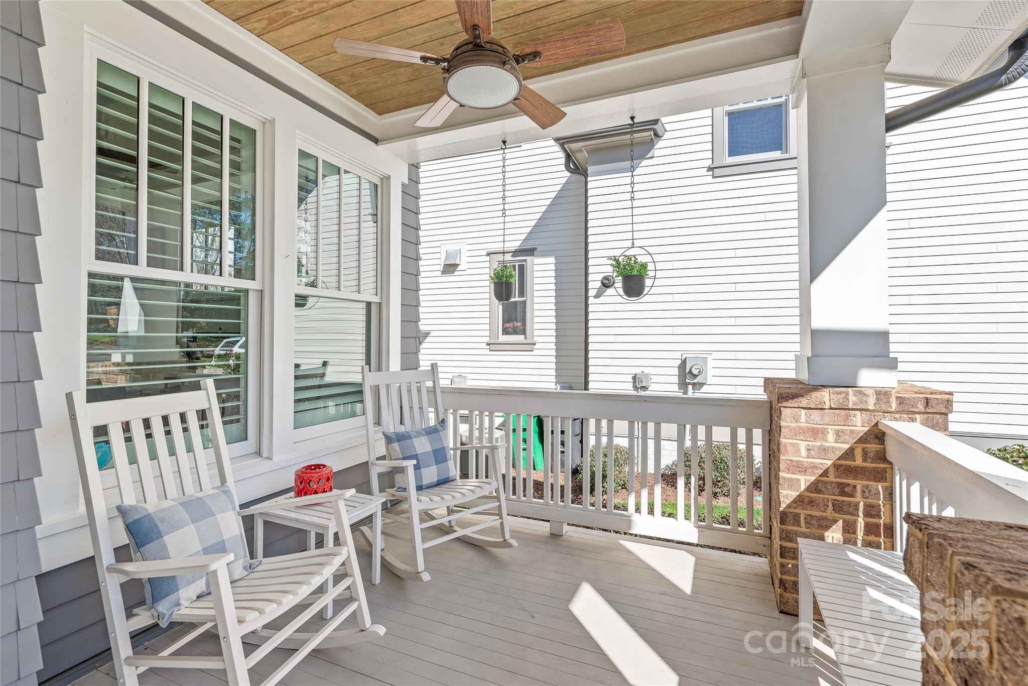 5717 Closeburn Road Charlotte, NC 28210 - Photo 3 of 40 a balcony with furniture and wooden floor