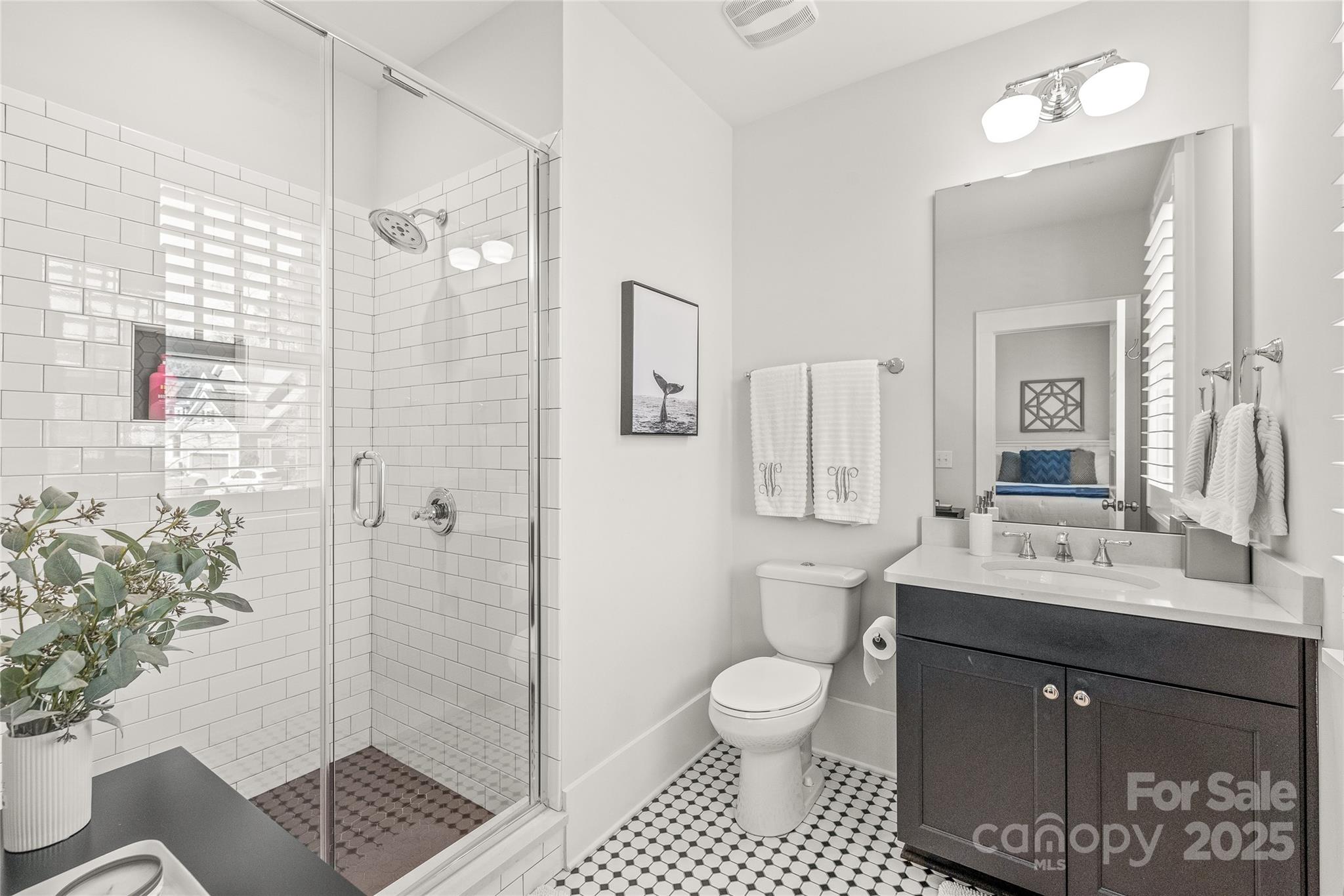 5717 Closeburn Road Charlotte, NC 28210 - Photo 32 of 40 a bathroom with a sink toilet and shower