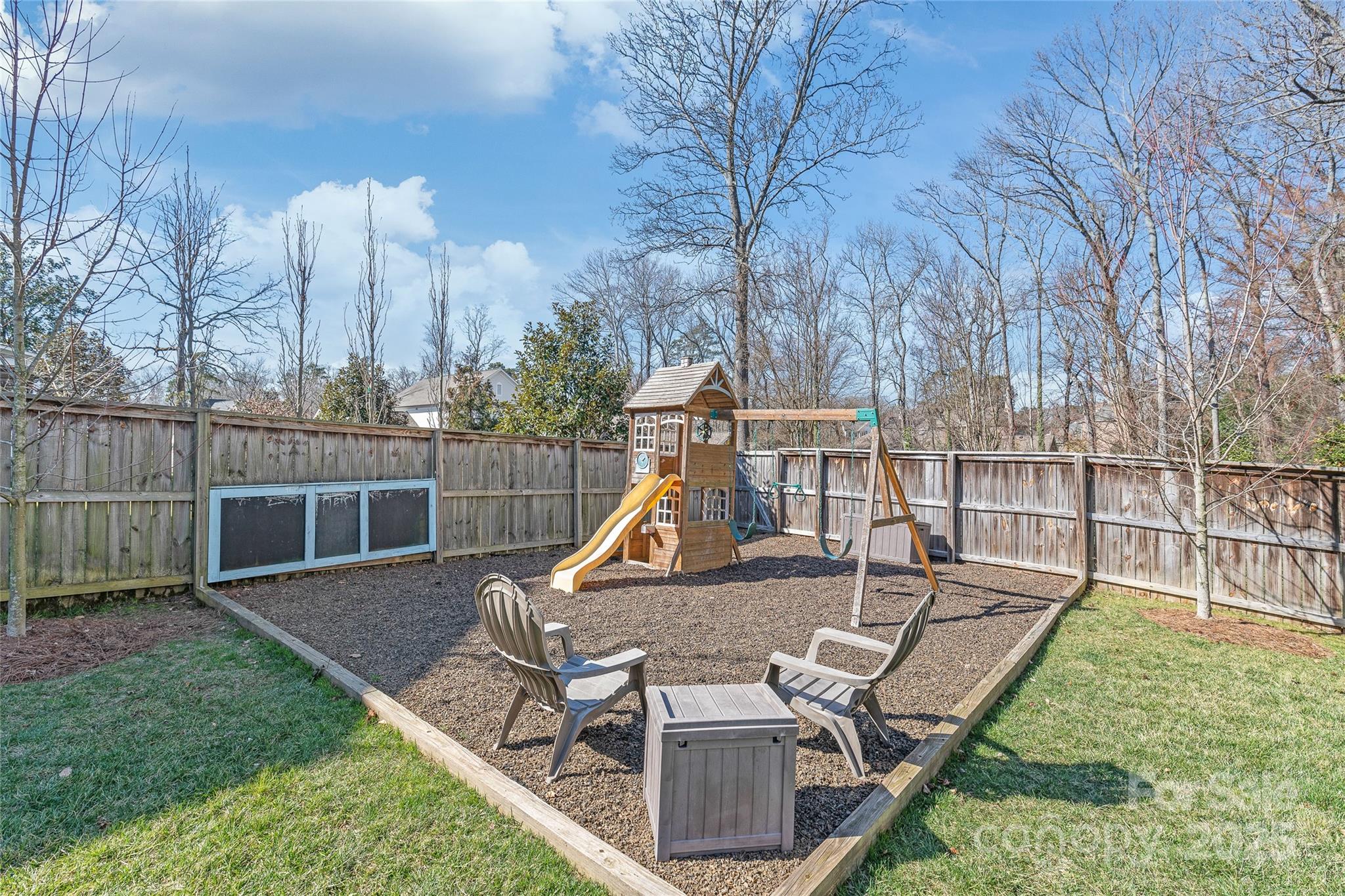 5717 Closeburn Road Charlotte, NC 28210 - Photo 38 of 40 a view of a house with backyard and sitting area