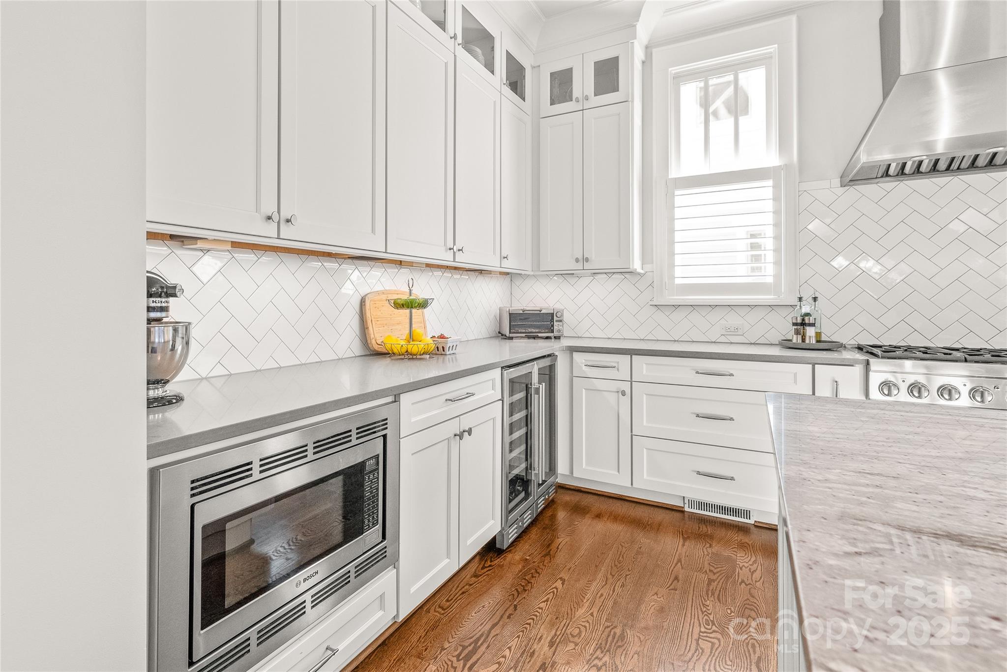 5717 Closeburn Road Charlotte, NC 28210 - Photo 8 of 40 a kitchen with granite countertop white cabinets and white appliances