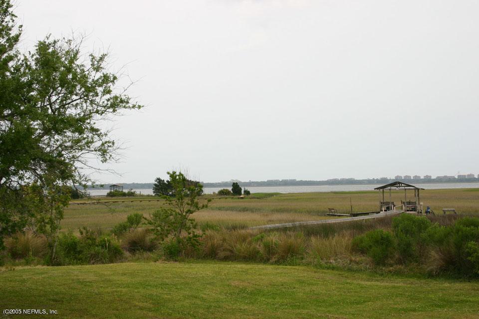 15663-65 Shellcracker Road Jacksonville, FL 32226 - Photo 10 of 11 a view of a lake with houses in all around