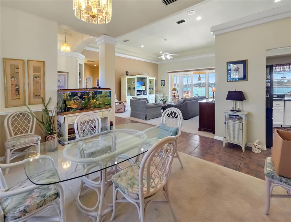 77 Hickory Loop Ocala, FL 34472 - Photo 12 of 50 a kitchen with granite countertop a table and chairs in it