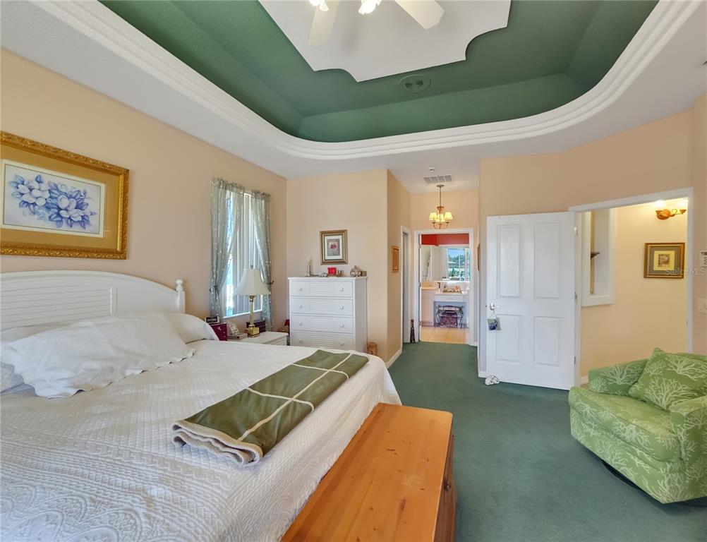 77 Hickory Loop Ocala, FL 34472 - Photo 17 of 50 a spacious bedroom with a bed and a couch