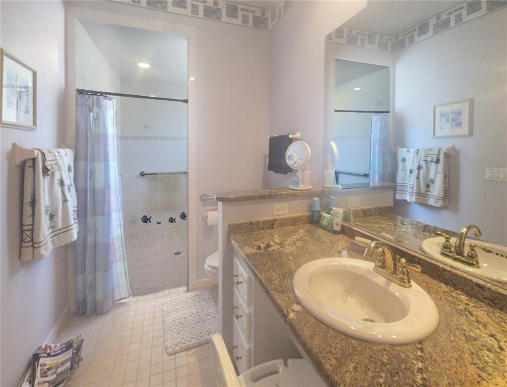 77 Hickory Loop Ocala, FL 34472 - Photo 24 of 50 a bathroom with a sink double vanity and shower