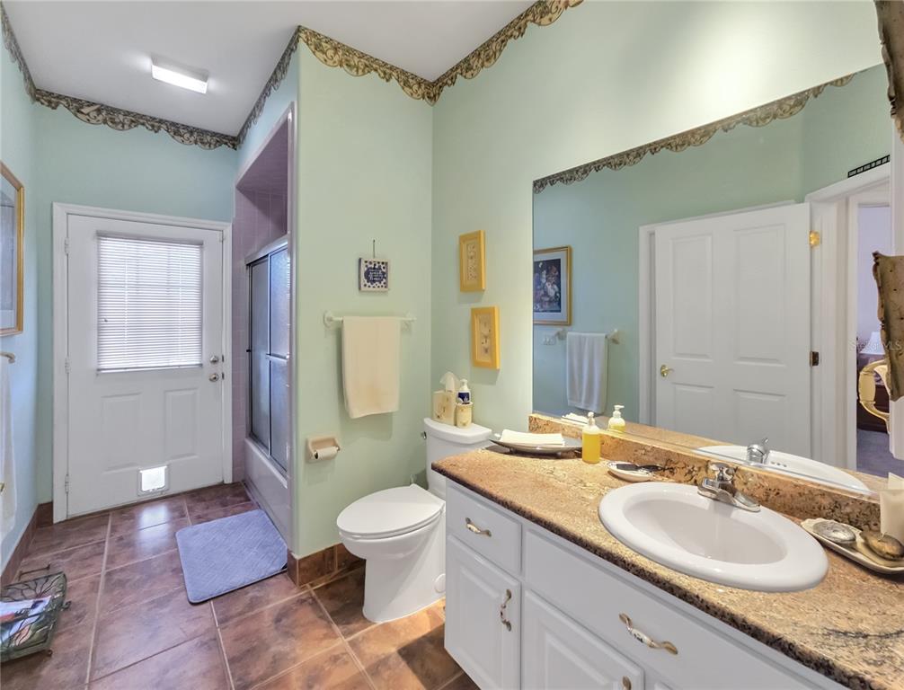 77 Hickory Loop Ocala, FL 34472 - Photo 30 of 50 a spacious bathroom with a granite countertop sink toilet and shower