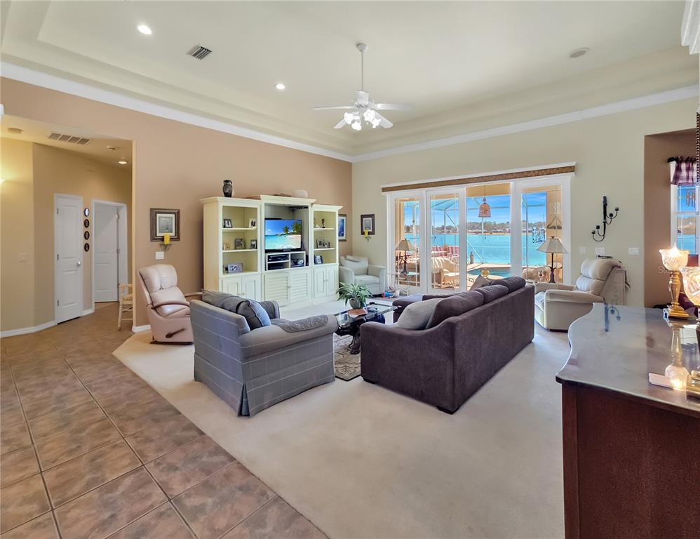 77 Hickory Loop Ocala, FL 34472 - Photo 9 of 50 a living room with furniture and a chandelier