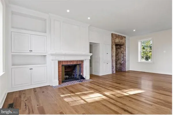 a view of livingroom with furniture and a fireplace