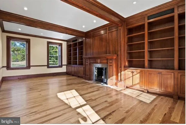 a view of an entryway with fireplace